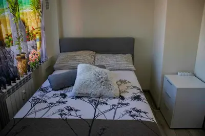 a small bed with two pillows on it in a bedroom at Newly renovated 2 bedroom apartment in Sofia in Sofia