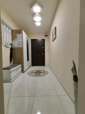 a hallway with a black door and a tile floor at Newly renovated 2 bedroom apartment in Sofia in Sofia