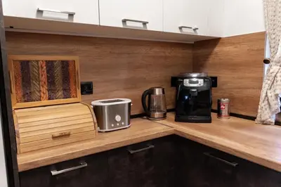 a coffeemaker and a coffee maker on a wooden counter at Martini villa Lake in Razlog