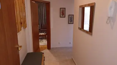 a hallway with a door leading to a room at Predela 1 in Bansko