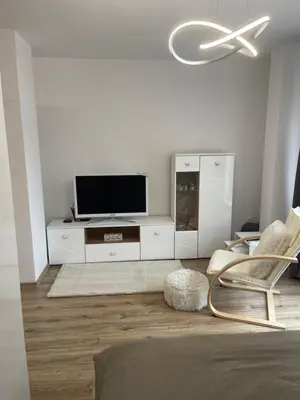 a living room with a tv and a chair at SOFIA CENTRAL LUXURY apartment 
