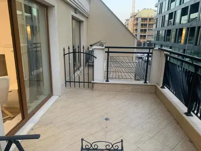 a balcony with a bench next to a building at SOFIA CENTRAL LUXURY apartment 