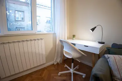 a bedroom with a desk and a bed and a window at Planeta dos sonhos - Fast Wi-Fi, 1BDR, Top centre in Sofia