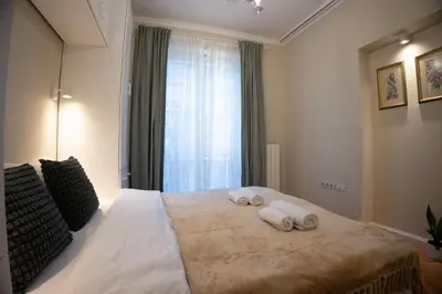 a bedroom with a large bed with towels on it at Planeta dos sonhos - Fast Wi-Fi, 1BDR, Top centre in Sofia