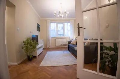 a living room with a couch and a window at Planeta dos sonhos - Fast Wi-Fi, 1BDR, Top centre in Sofia
