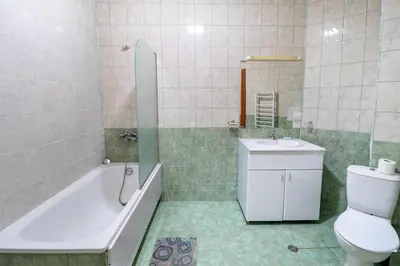 a bathroom with a tub and a toilet and a sink at Charming one bed apartment 423 in main Flora building in Borovets
