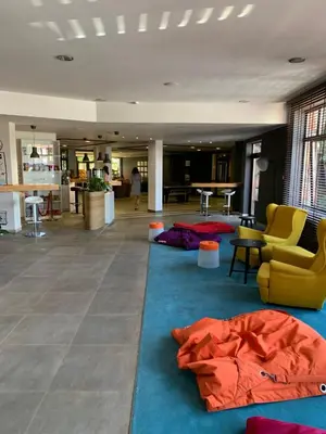a living room with blue and red carpets on the floor at Lorena’s Apartment Bansko,near Gondola in Bansko