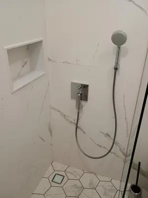 a bathroom with a shower with a shower head at Luxury rooms 12-2 in Plovdiv