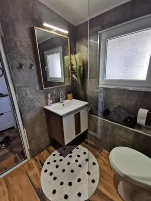 a bathroom with a sink and a shower at Charming City Apartment SIYANA - Self Check-in in Panagyurishte
