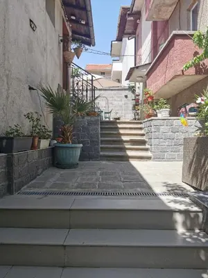 a set of stairs leading up to a building at Charming City Apartment SIYANA - Self Check-in in Panagyurishte