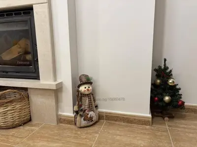 a teddy bear standing next to a christmas tree at Апартамент за гости 4а26 Планинска Магия Grand Monastery Пампорово in Pamporovo