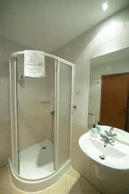 a bathroom with a shower and a sink at Studio Villa Park 325 in Borovets