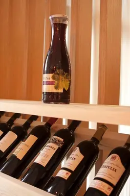 a bottle of wine is sitting on a shelf at Studio Villa Park 325 in Borovets