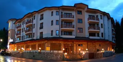 a large white building with lights in front of it at Studio Villa Park 325 in Borovets