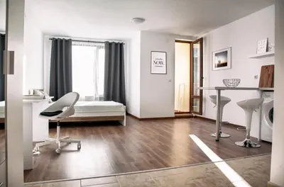 a white room with a desk and a chair at New White Studio F next to Forest the Gondola in Bansko