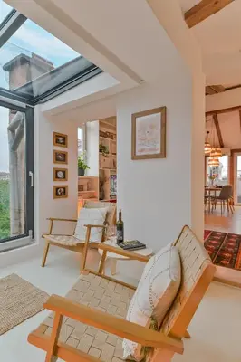 a living room with a couch and a table at Dreamy Sunset Loft in Sofia City Center in Sofia