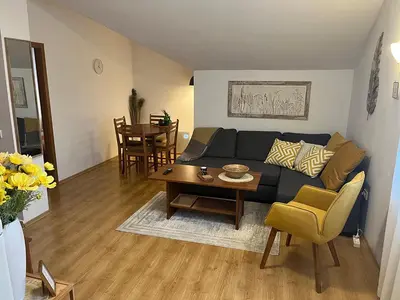 a living room with a couch and a table at Boro Hills in Borovets