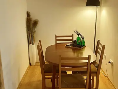 a dining room table with chairs and a vase at Boro Hills in Borovets