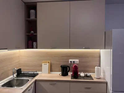 a kitchen with a sink and a counter top at Cappuccino apartment in Sofia
