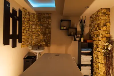 a bathroom with a table and a stack of towels at Paradise SPA Hotel in Tsigov Chark