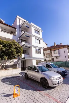 a silver car parked in front of a building at Apartment Betty in Sandanski