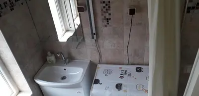 a small bathroom with a sink and a toilet at Studio V Plovdiv in Plovdiv