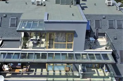 an aerial view of a building with a balcony at Sky Apartments in Blagoevgrad