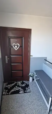 a room with a door with a heart sign on it at Black and White Apartment in Karlovo