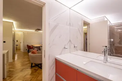 a bathroom with a sink and a mirror at SOFapart Boutique Apartments in Sofia