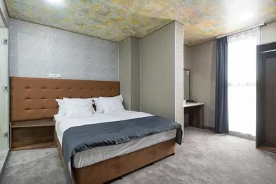 a bedroom with a bed with a painting on the ceiling at Hotel Boutique 5 - Free parking - Free breakfast - Free internet - EVSE in Sofia