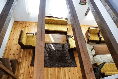 an overhead view of a living room with wooden floors at Delchovski Han in Delchevo