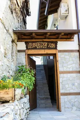 an entrance to a building with a sign on it at Delchovski Han in Delchevo