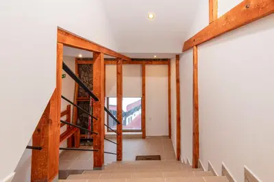 a staircase in a house under construction with wooden beams at The Golden Nest - 3 Bedroom Family Mountain Apartment in Pamporovo