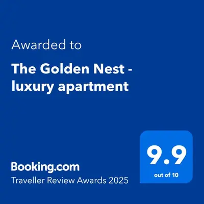 a blue sign that reads awarded to the golden nest luxury apartment at The Golden Nest - 3 Bedroom Family Mountain Apartment in Pamporovo