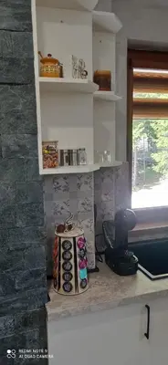 a kitchen with a counter with a bunch of donuts at АПАРТАМЕНТ WISH in Pamporovo