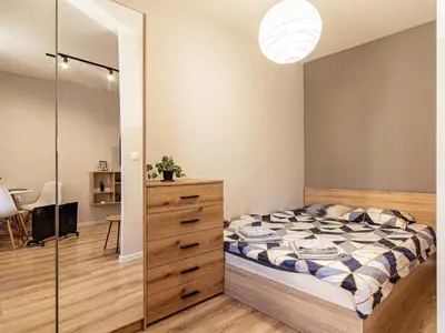 a bedroom with a bed and a glass closet at Trocadero Touch: Sofia Hideaway in Sofia