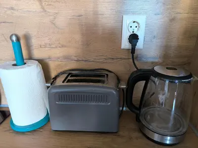 a counter with a toaster and a blender and a switch at Beautiful Apartment in Bansko
