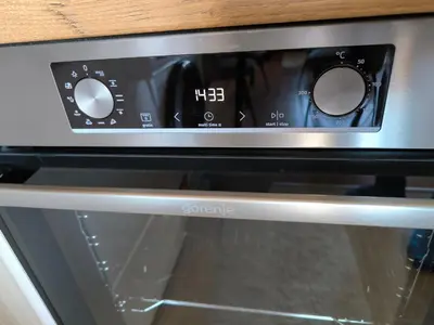 a close up of a microwave oven with its knobs at Beautiful Apartment in Bansko