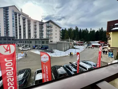 a group of cars parked in a parking lot at Elite Apartments Complex Iglika Borovets in Borovets
