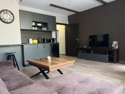 a living room with a couch and a coffee table at Elite Apartments Complex Iglika Borovets in Borovets