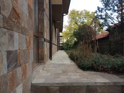 a brick alleyway next to a building at Banderitsa Apartment 2 in Bansko