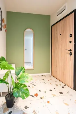 a room with a door and a potted plant at Design 1BDR Apartment near City Center in Sofia