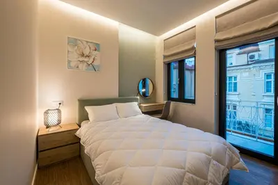 a bedroom with a large white bed and a window at North 21 - Brand New Modern 1BD Apt in Sofia Center by Flat Mаnager in Sofia
