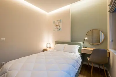 a bedroom with a bed and a desk and a mirror at North 21 - Brand New Modern 1BD Apt in Sofia Center by Flat Mаnager in Sofia