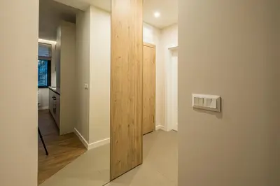 a hallway with a wooden door in a house at North 21 - Brand New Modern 1BD Apt in Sofia Center by Flat Mаnager in Sofia