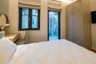a bedroom with a large white bed and a window at North 21 - Brand New Modern 1BD Apt in Sofia Center by Flat Mаnager in Sofia