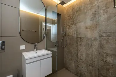 a bathroom with a sink and a mirror at South 22 - Brand New Modern 1BD Apt in Sofia Center by Flat Mаnager in Sofia