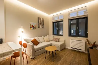 a living room with a couch and a table at South 22 - Brand New Modern 1BD Apt in Sofia Center by Flat Mаnager in Sofia