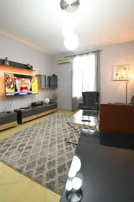 a living room with a couch and a table at INB Iconic Spot in Sofia