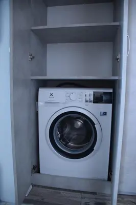 a washer and dryer in a small room at New 1930s quiet central apartment w/AC - 2 bedroom in Sofia
